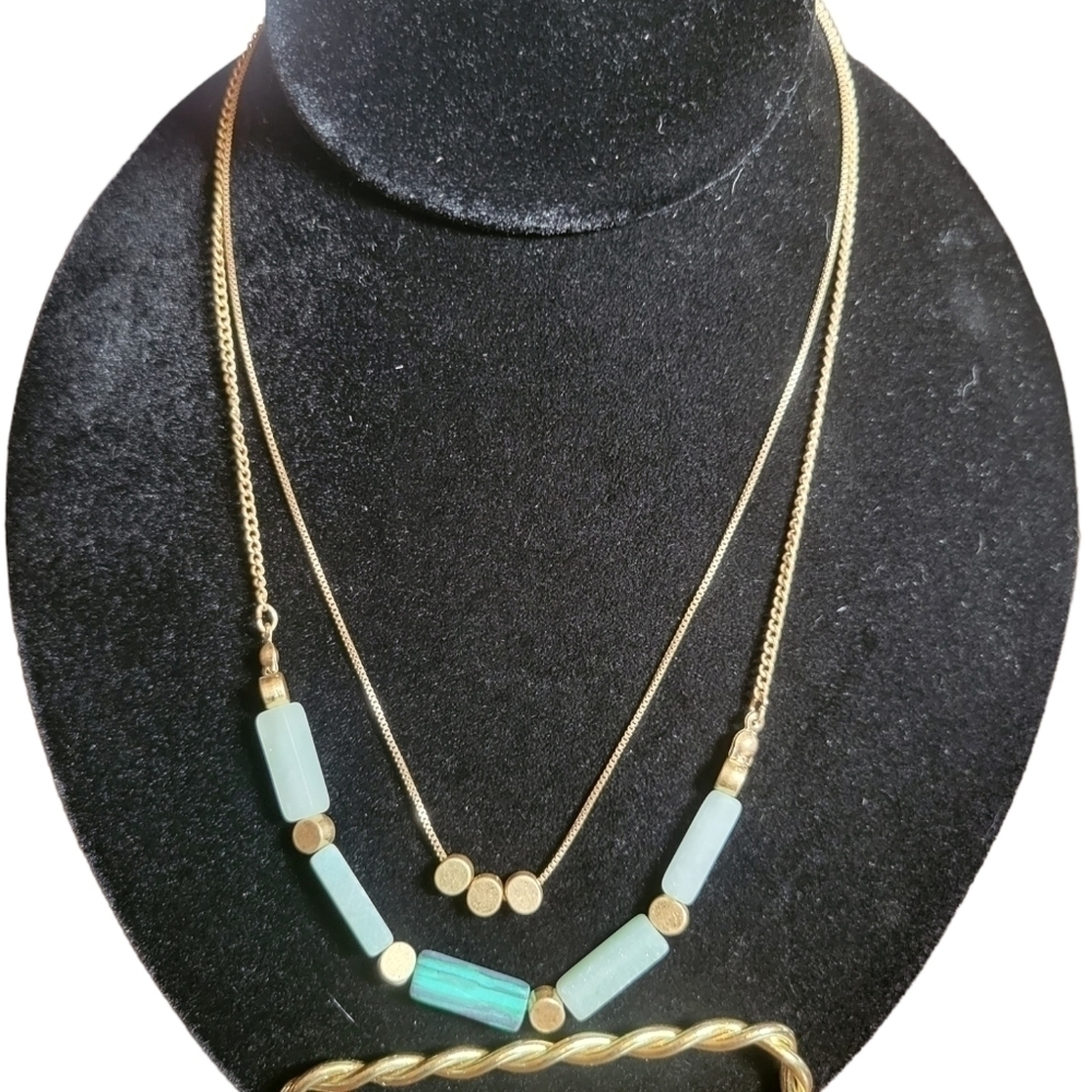 Gold tone necklace with delicate stones